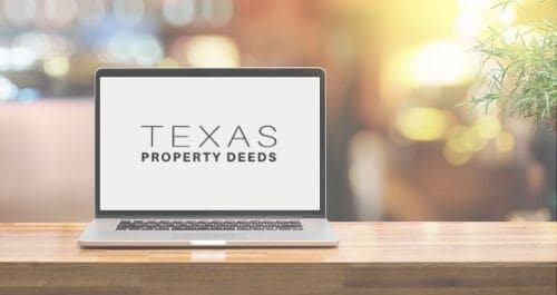 A laptop on a wooden desk with the logo for Texas Property Deeds on the screen.
